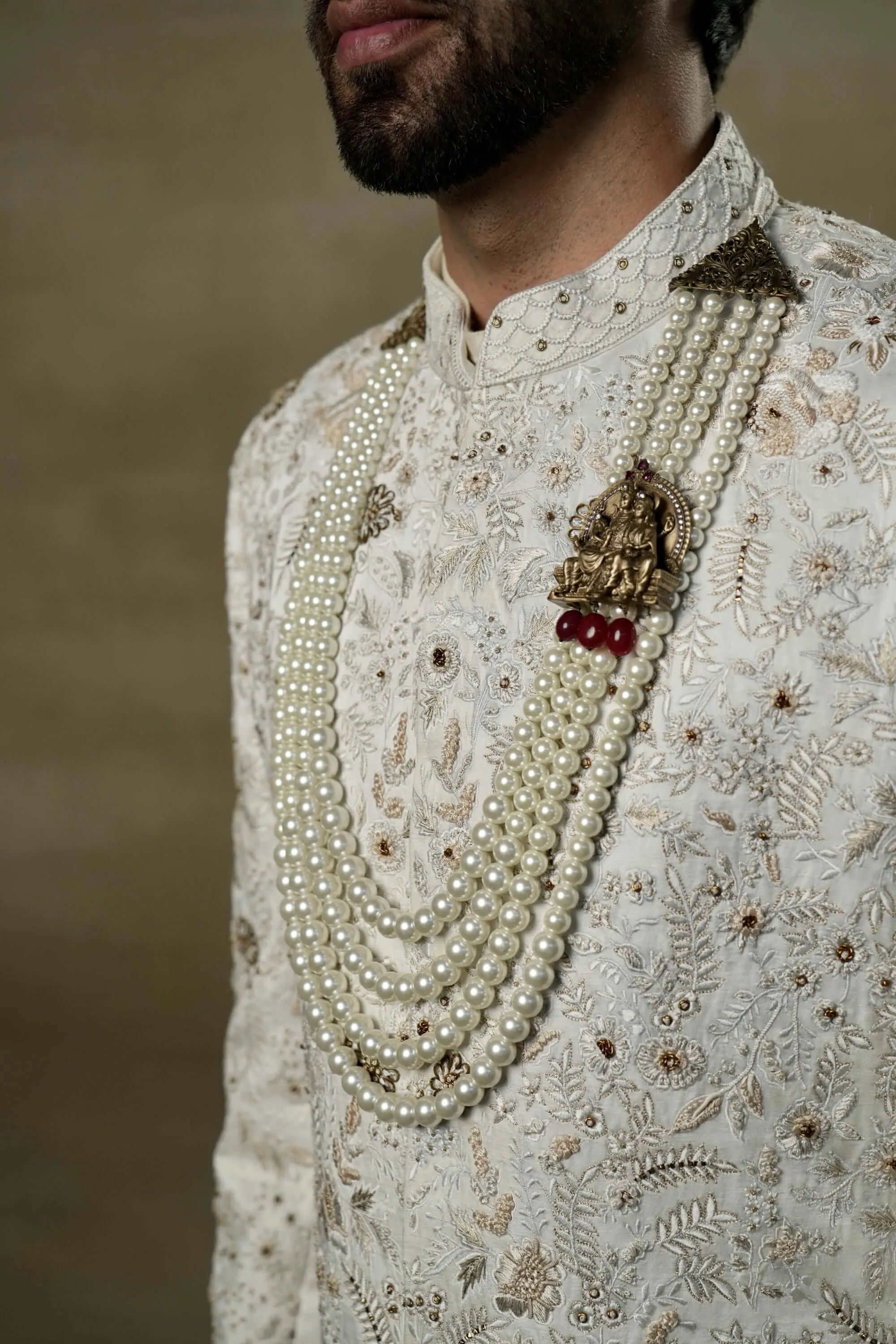 Ivory and gold sherwani set