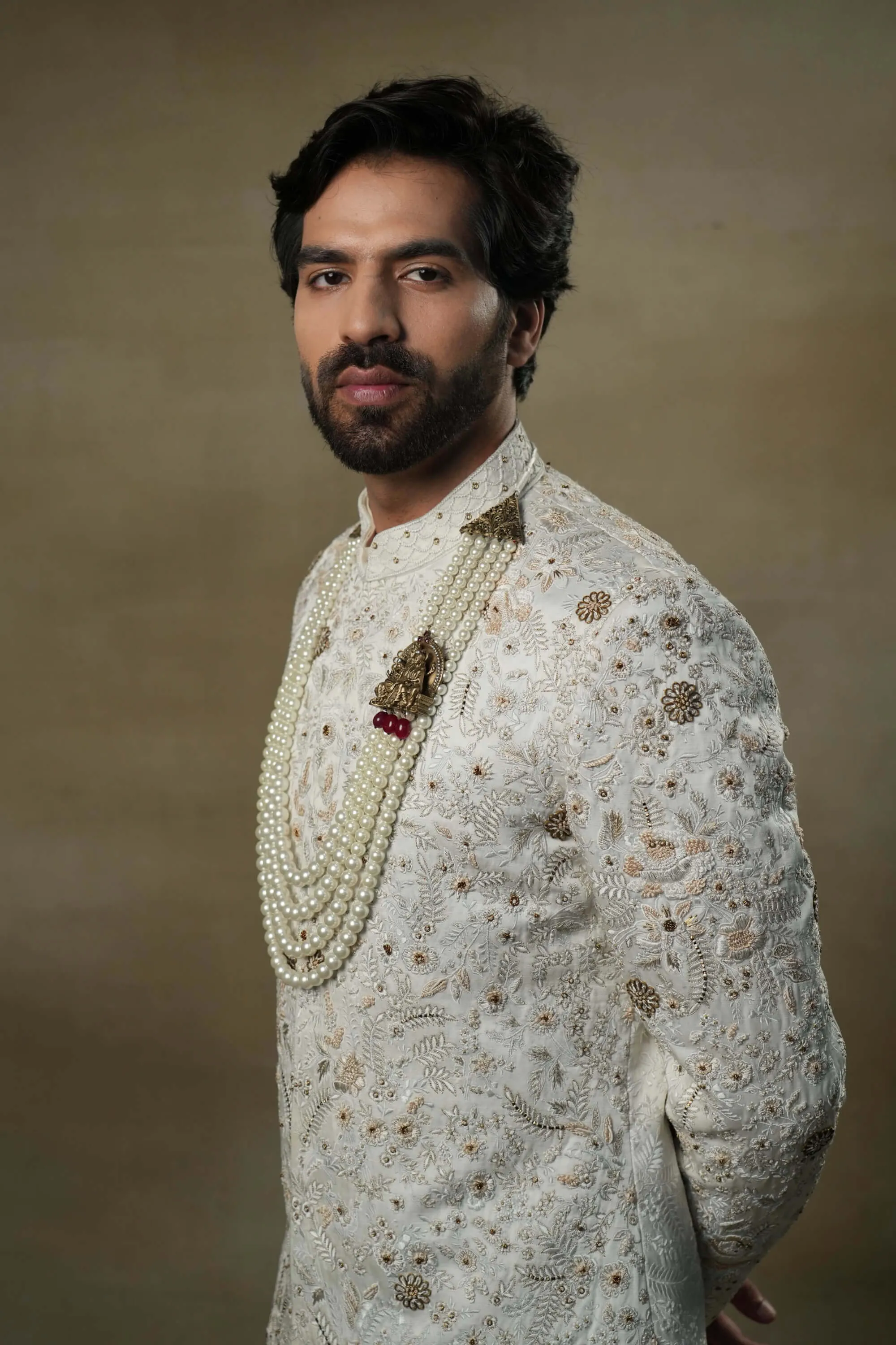 Ivory and gold sherwani set