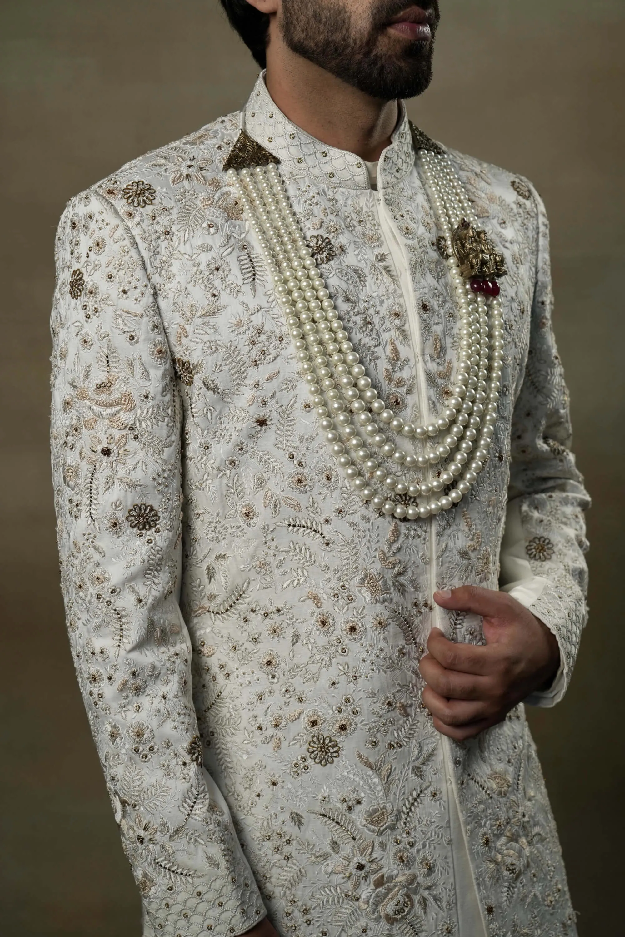 Ivory and gold sherwani set